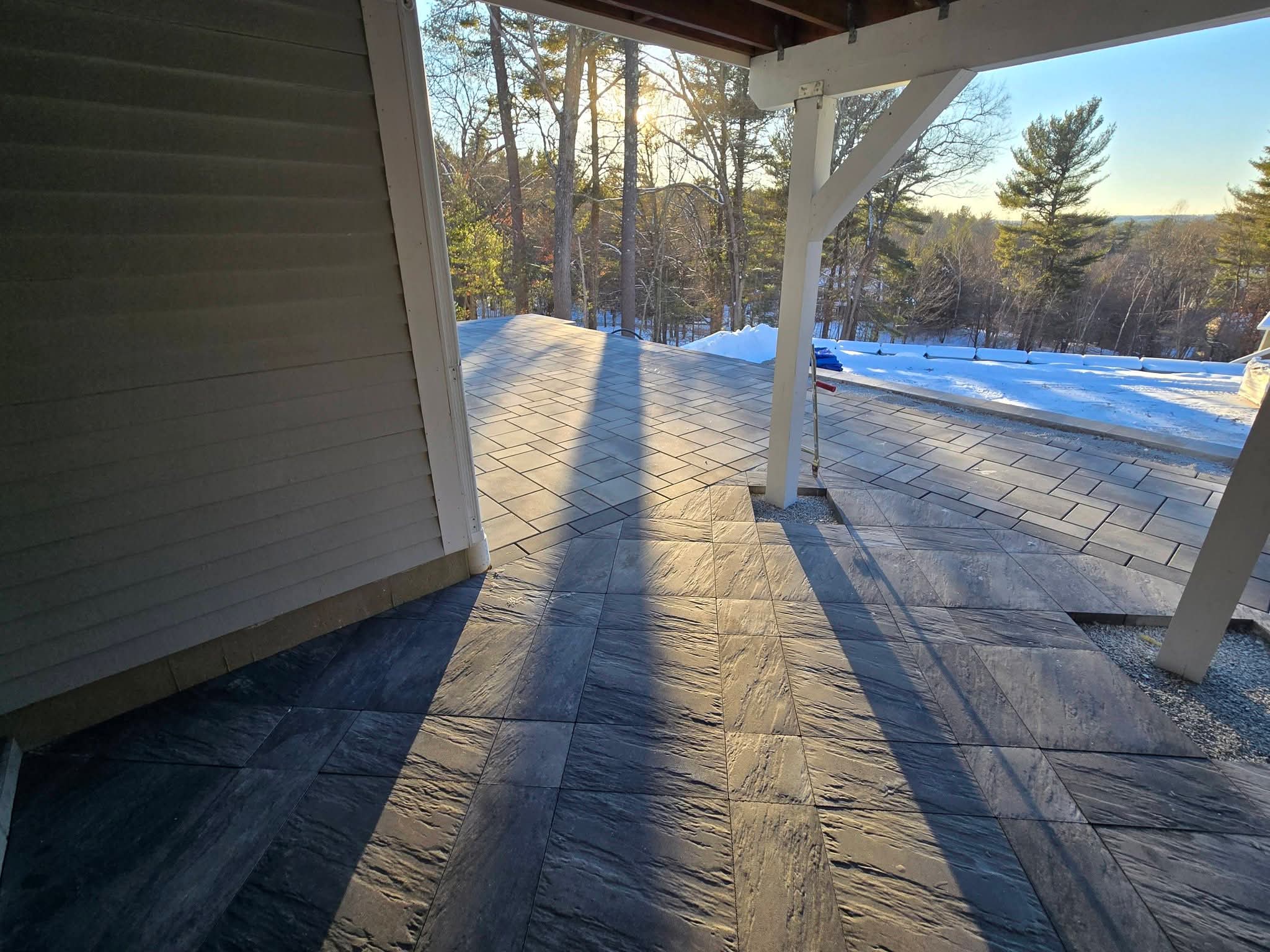 Large paver patio with seating area