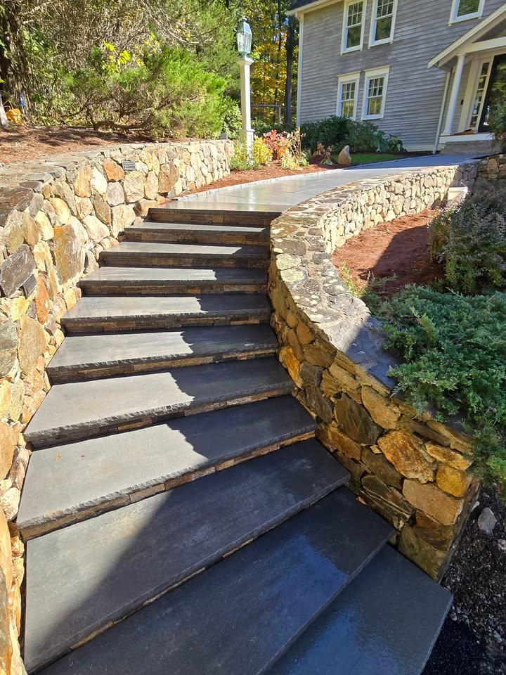 Stone steps leading to a paver landing