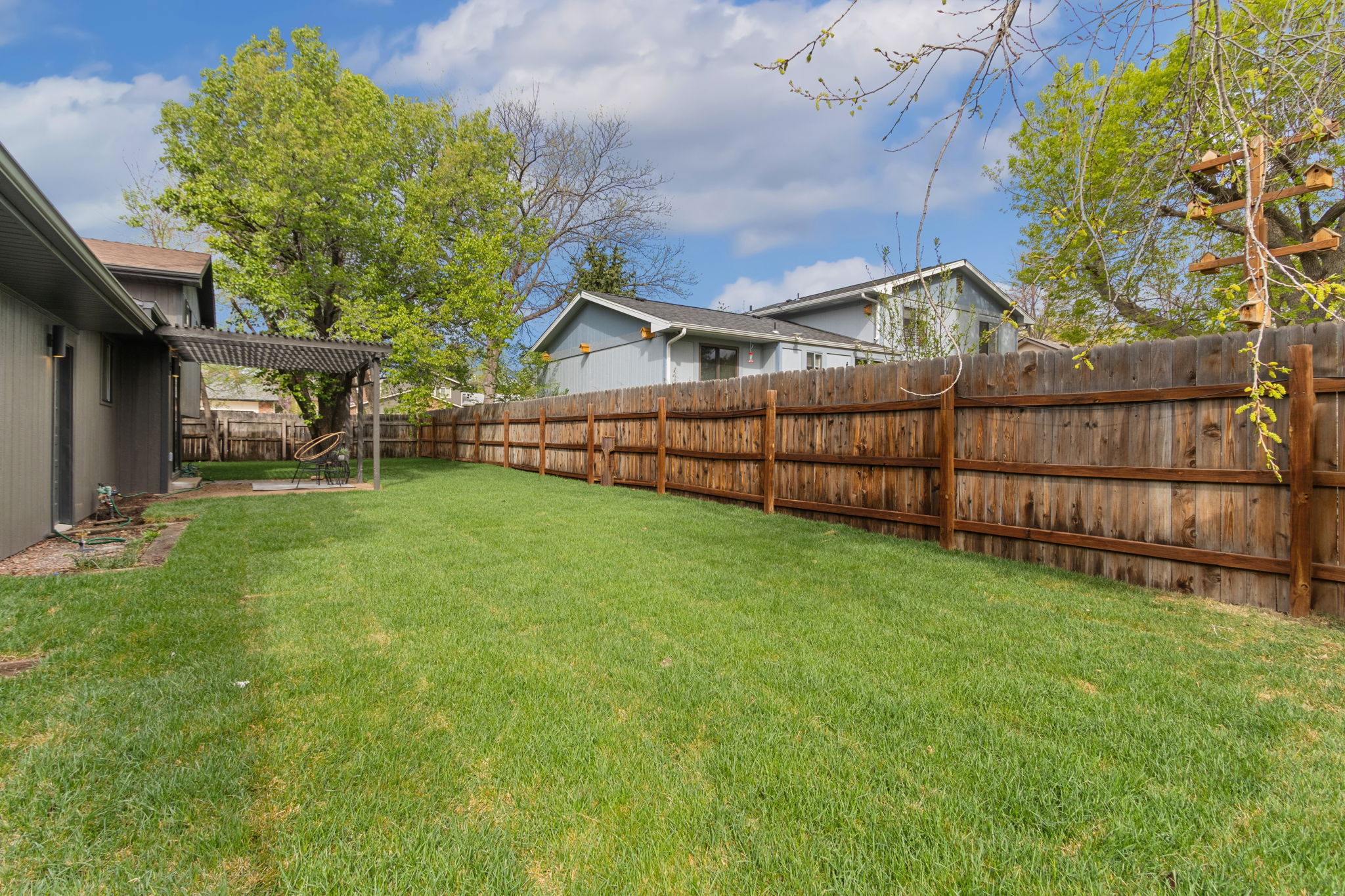 Long fenced back lawn running along the side of the property