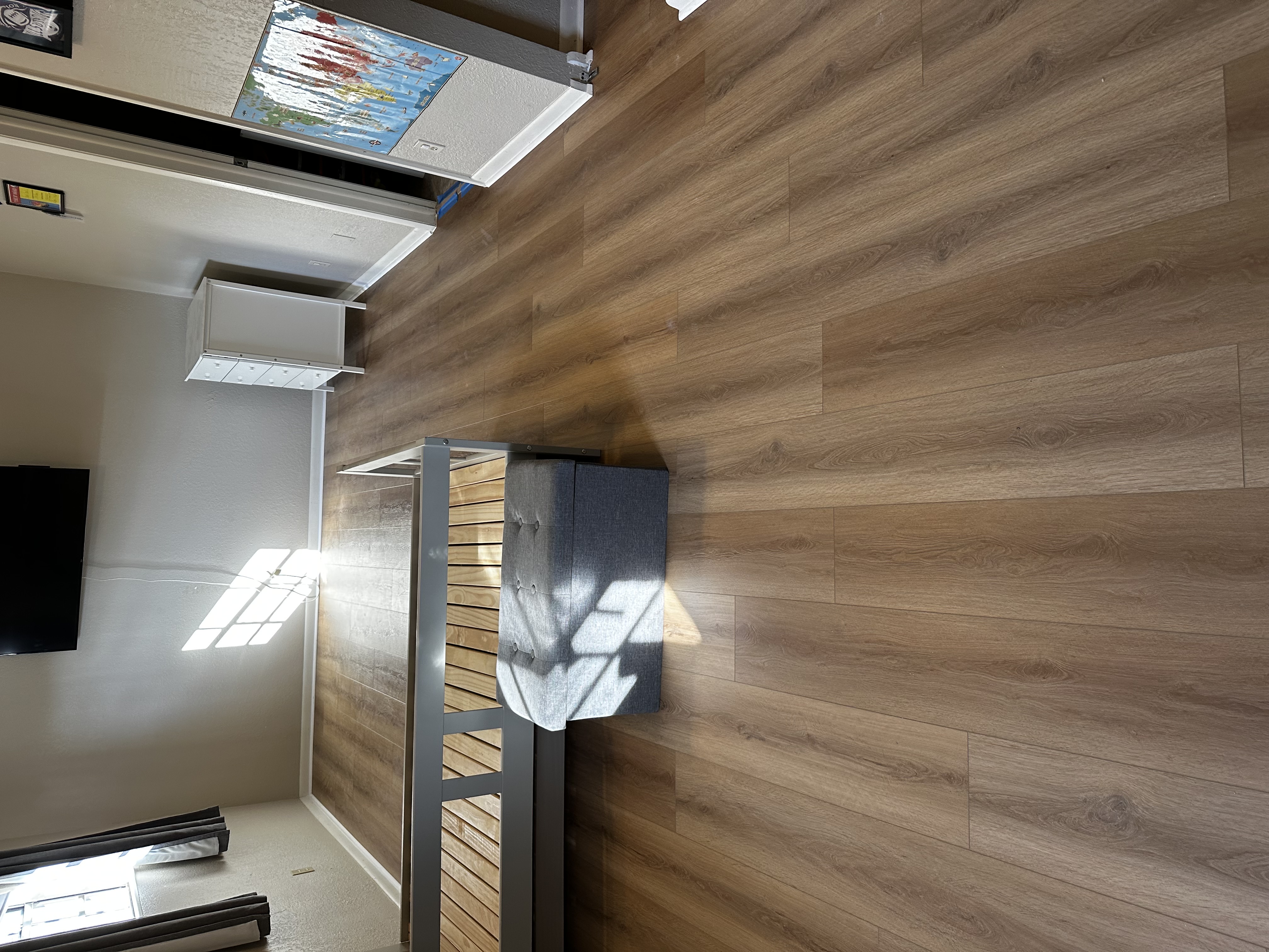 Furnished Tampa, FL bedroom with new medium plank flooring