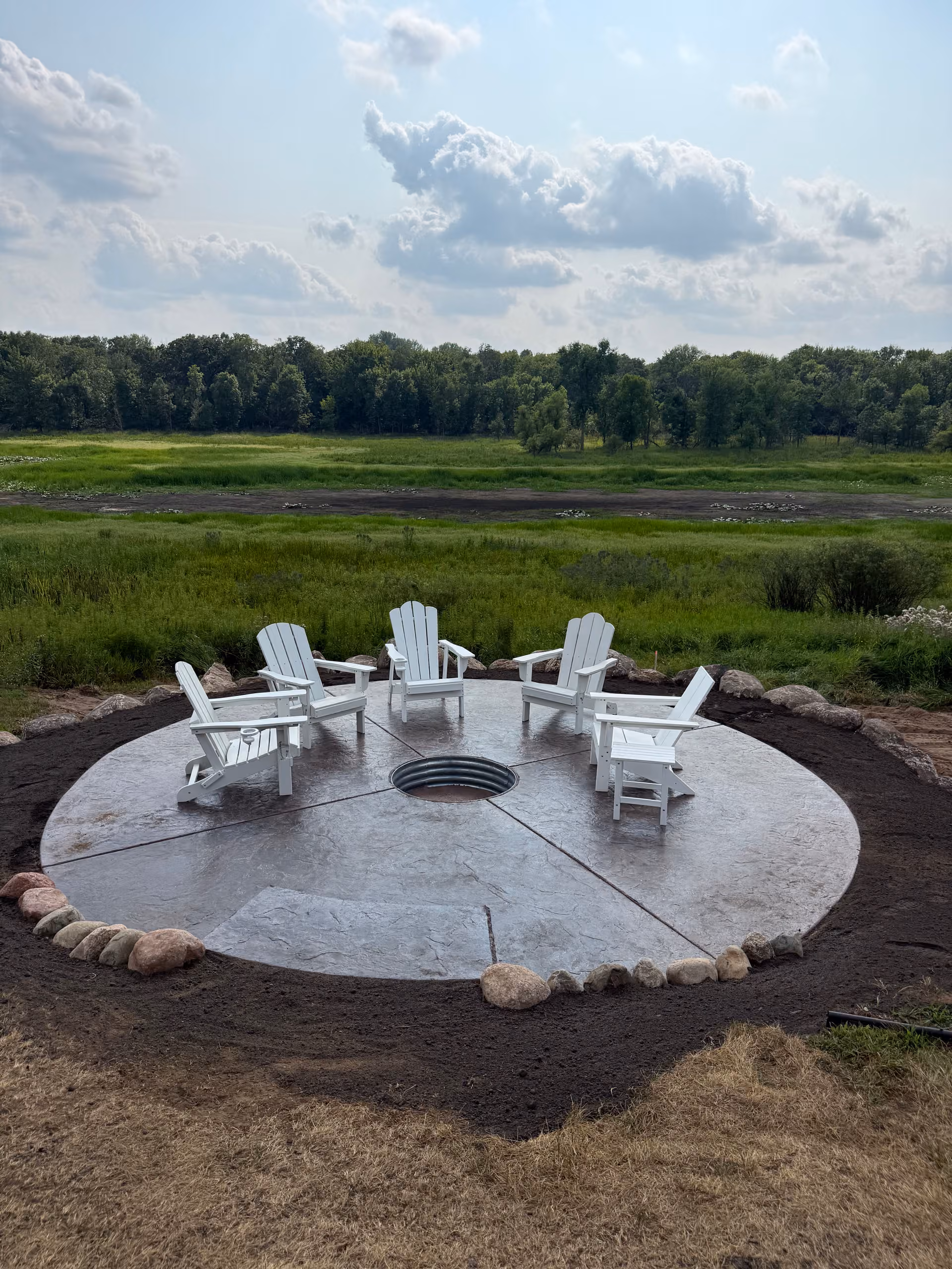 Stamped Concrete Patio and Boulder Wall in Isanti