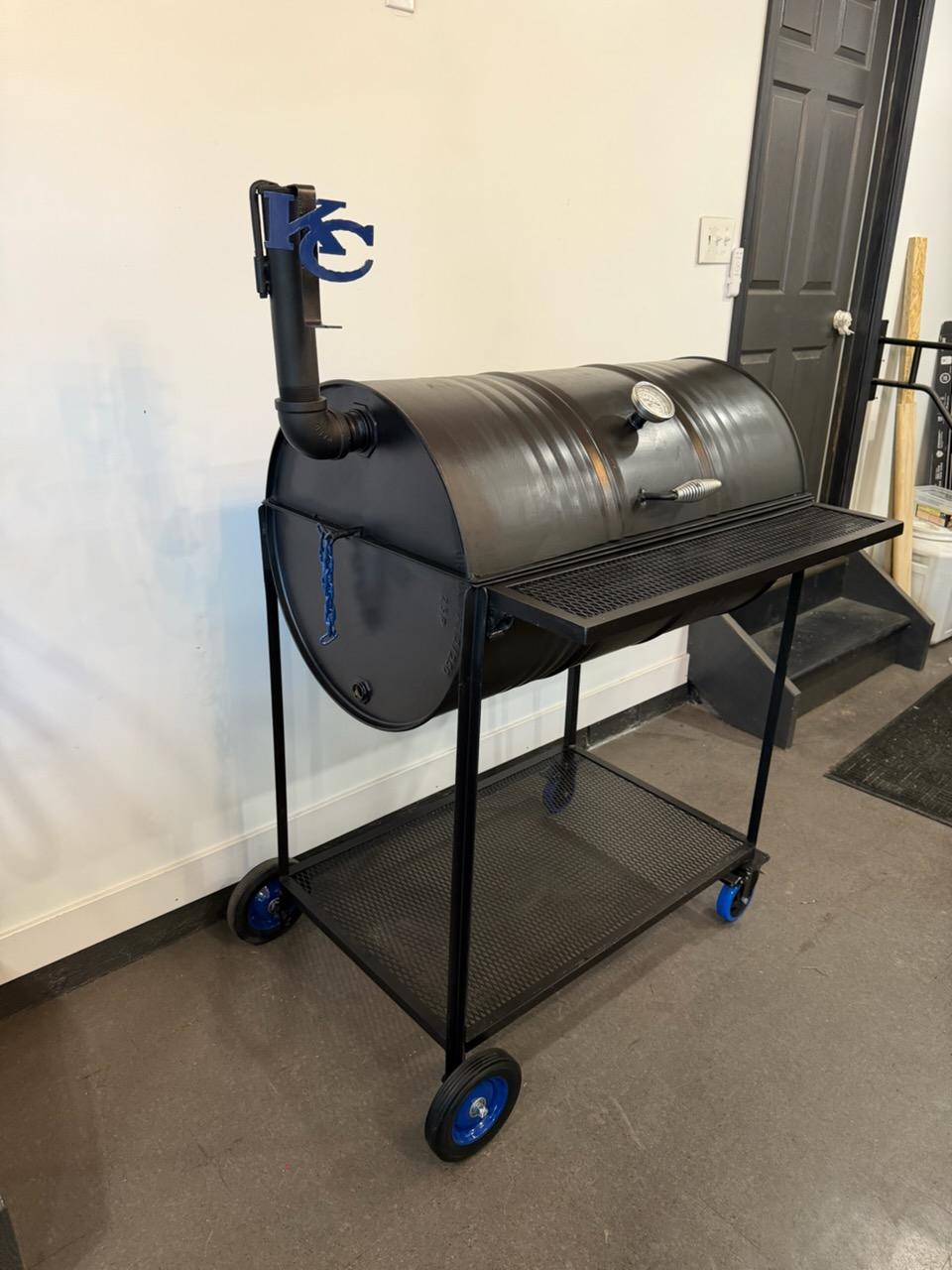 55 gallon drum smoker on a rolling cart, side view