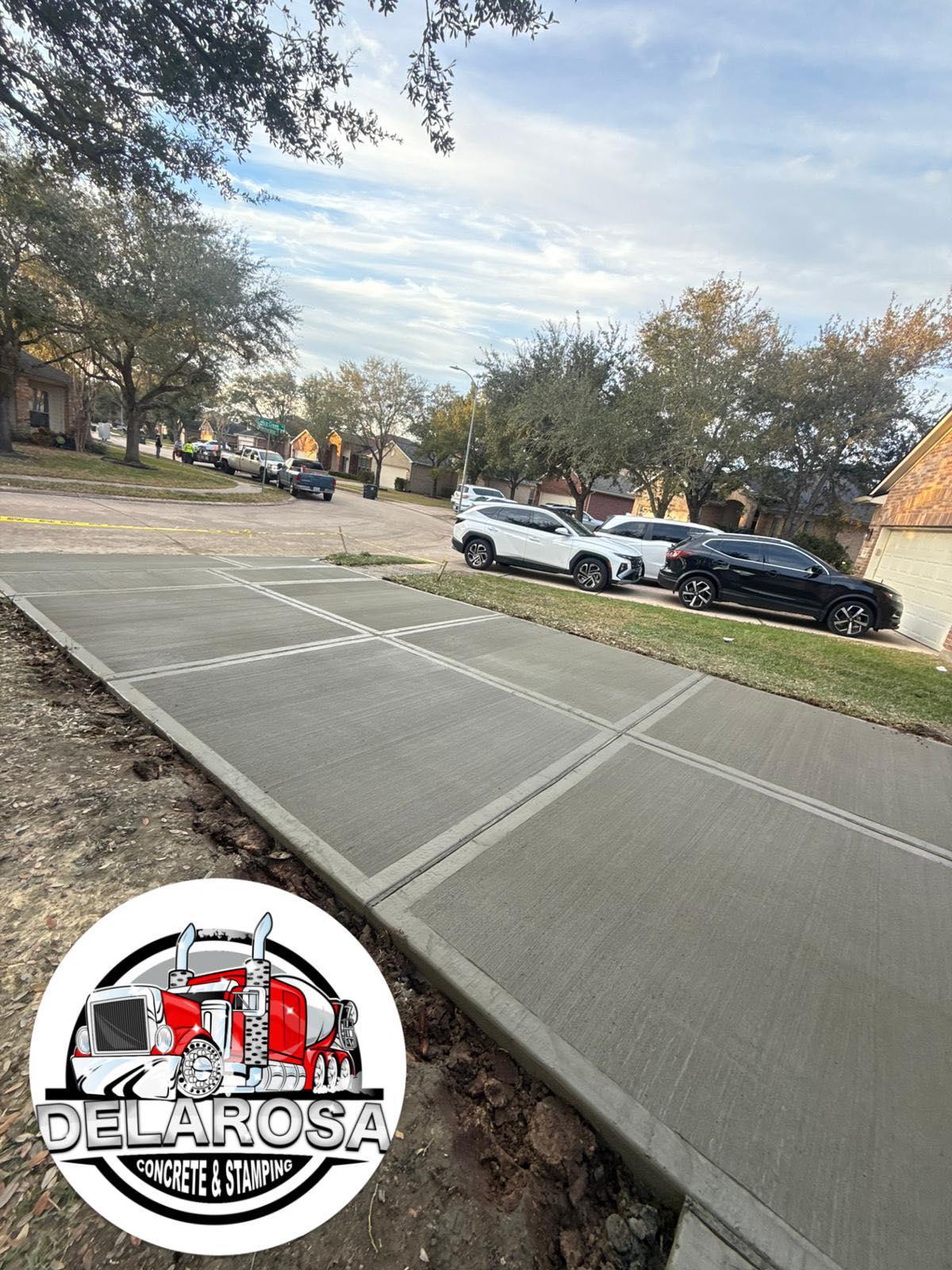 Freshly poured concrete driveway and walkway at a Greater Houston home
