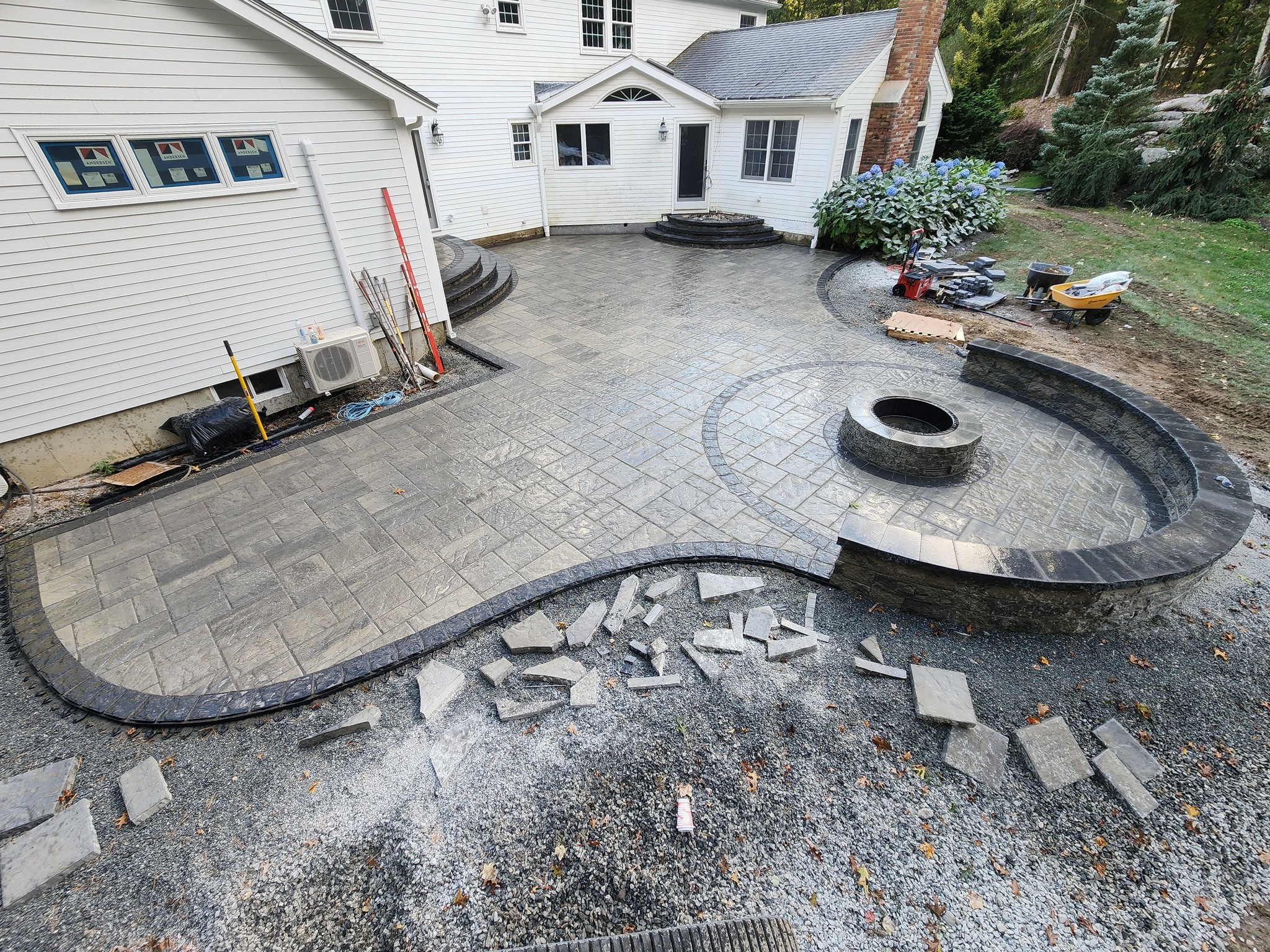 Paver patio with built-in outdoor fireplace