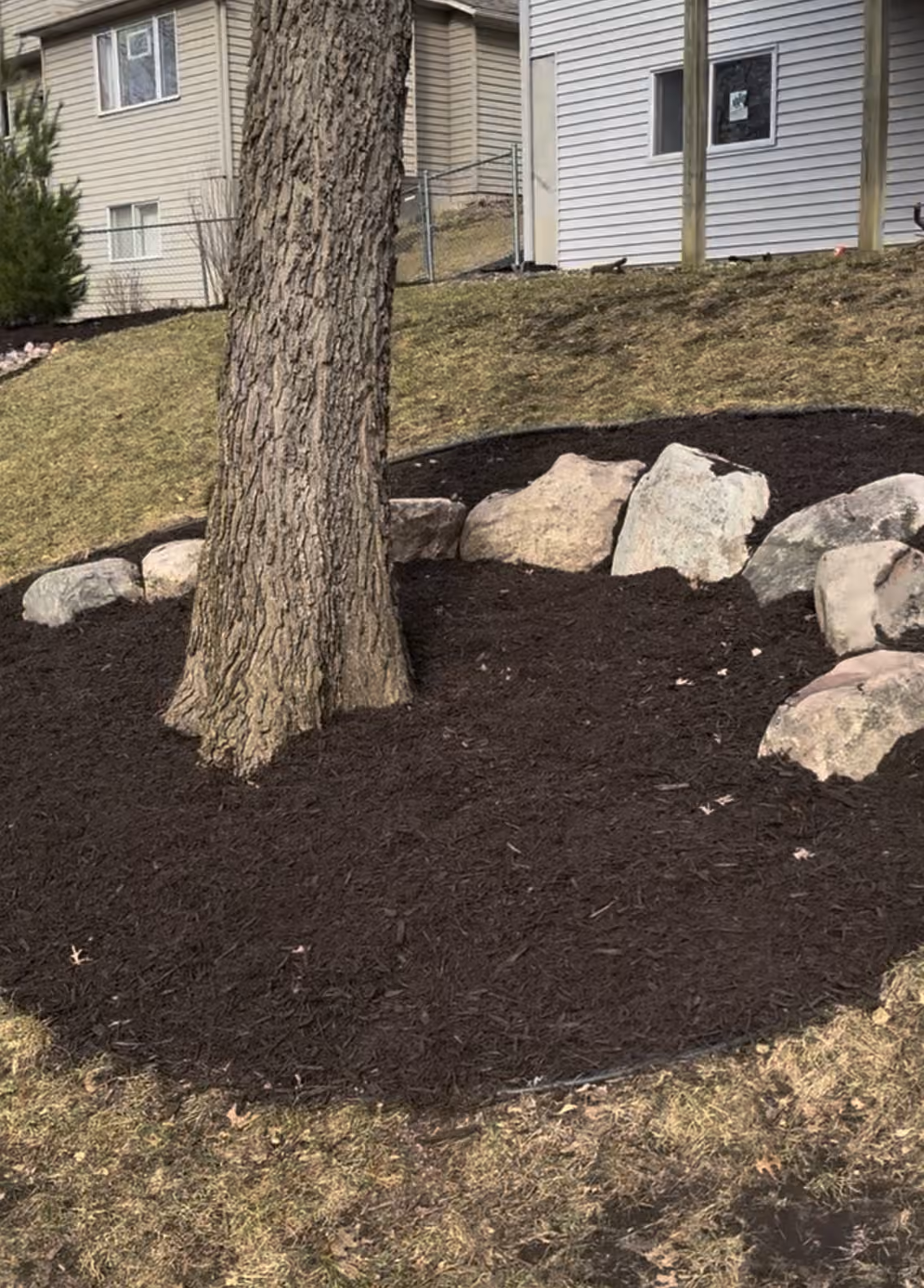 Fresh Mulch and Boulder Edging That Actually Makes a Yard Pop