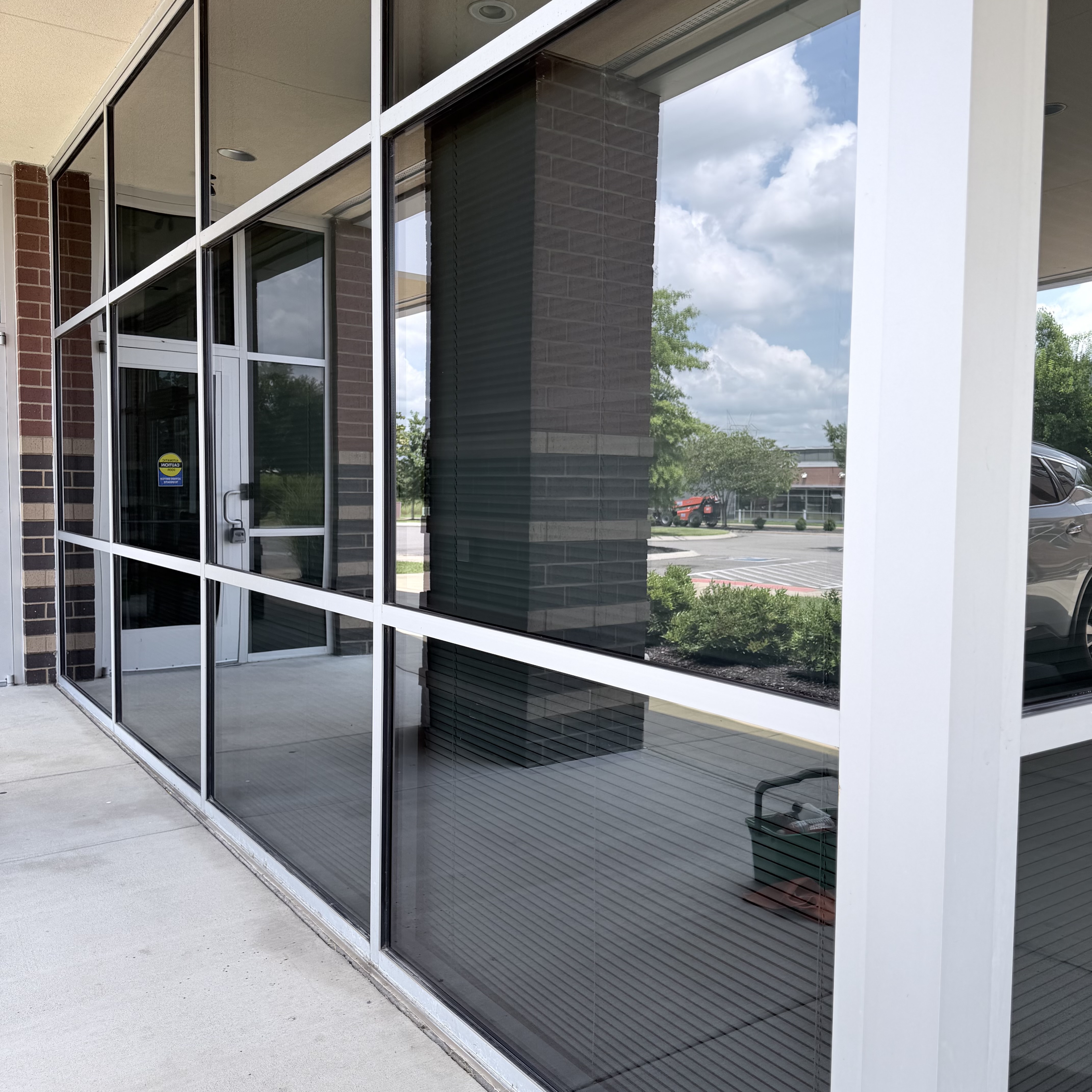 Streak-free storefront glass and entry doors at a commercial retail building