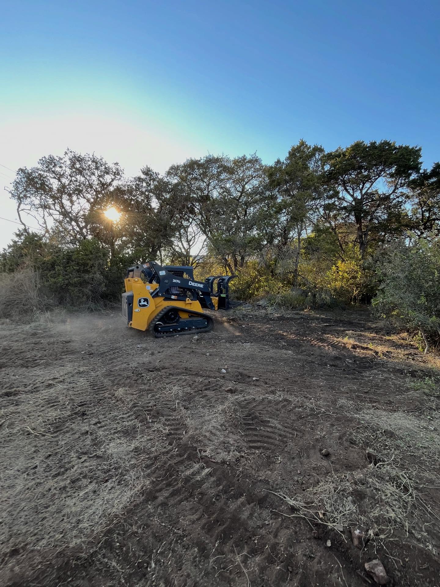 Bulldozer and trailer in field