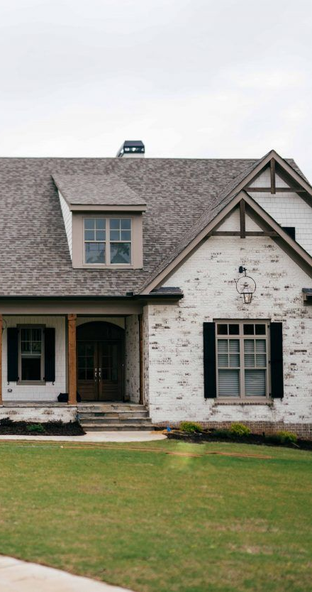 Grey stone facade with weathered lime wash (feature photo)