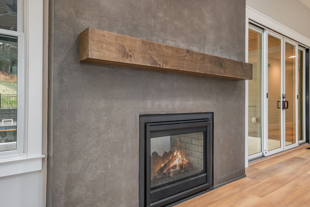 Man smoothing plaster on a wall with a trowel (feature photo)