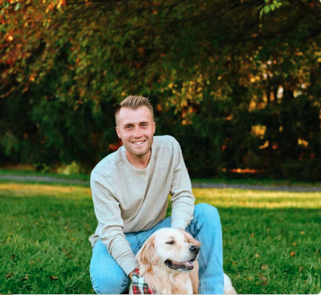 Joel Mercadante, owner of Golden Vision Properties, with his golden retriever Saban
