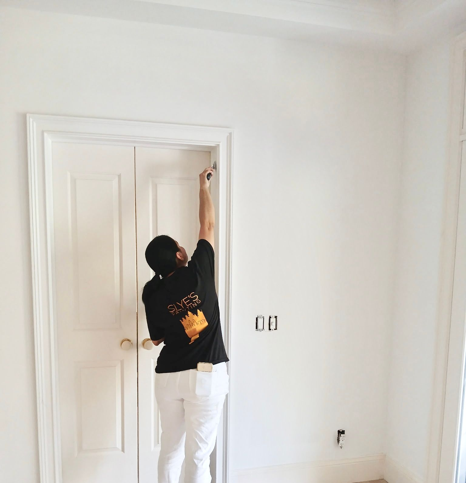 Painter doing a touch-up (hero photo)