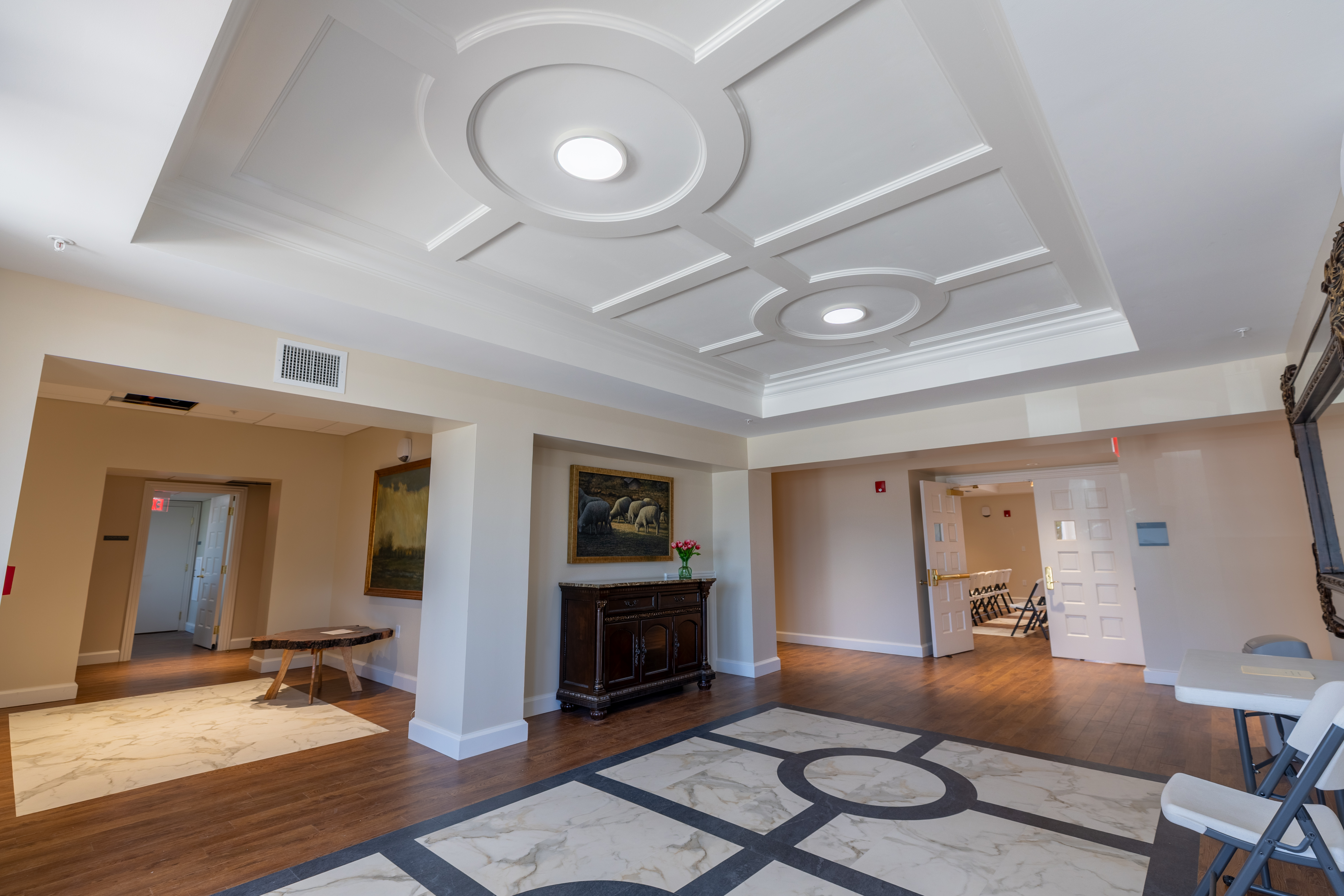 Custom wainscoting framing stained glass windows
