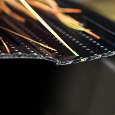 Eclipse offset micro-perforations blocking pine needles