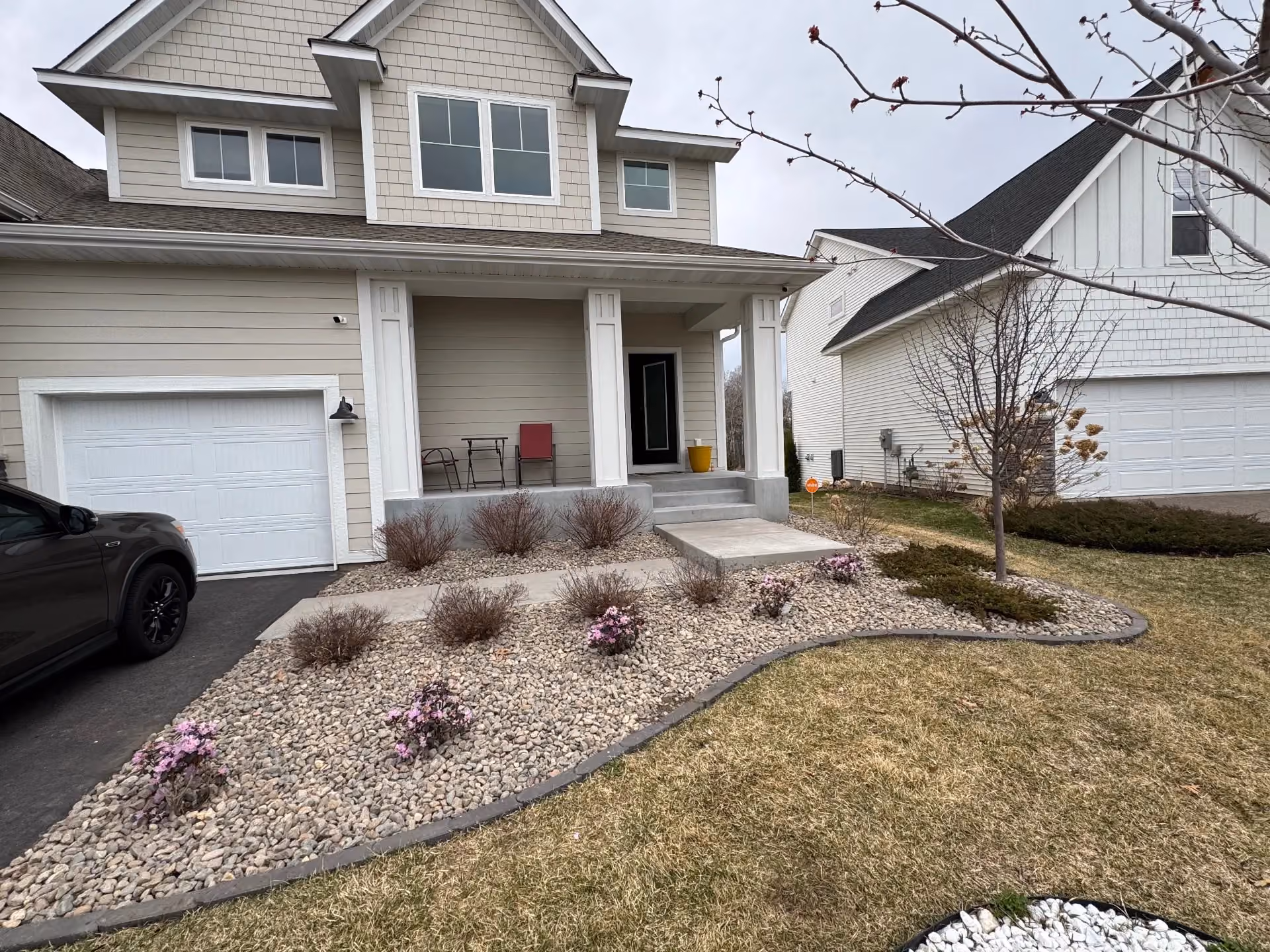 River Rock and Steel Edging Upgrade That Sharpens Curb Appeal