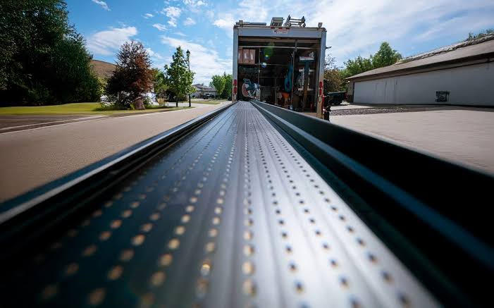 Alu-Rex gutter guard being unloaded from the truck on a Sudbury job