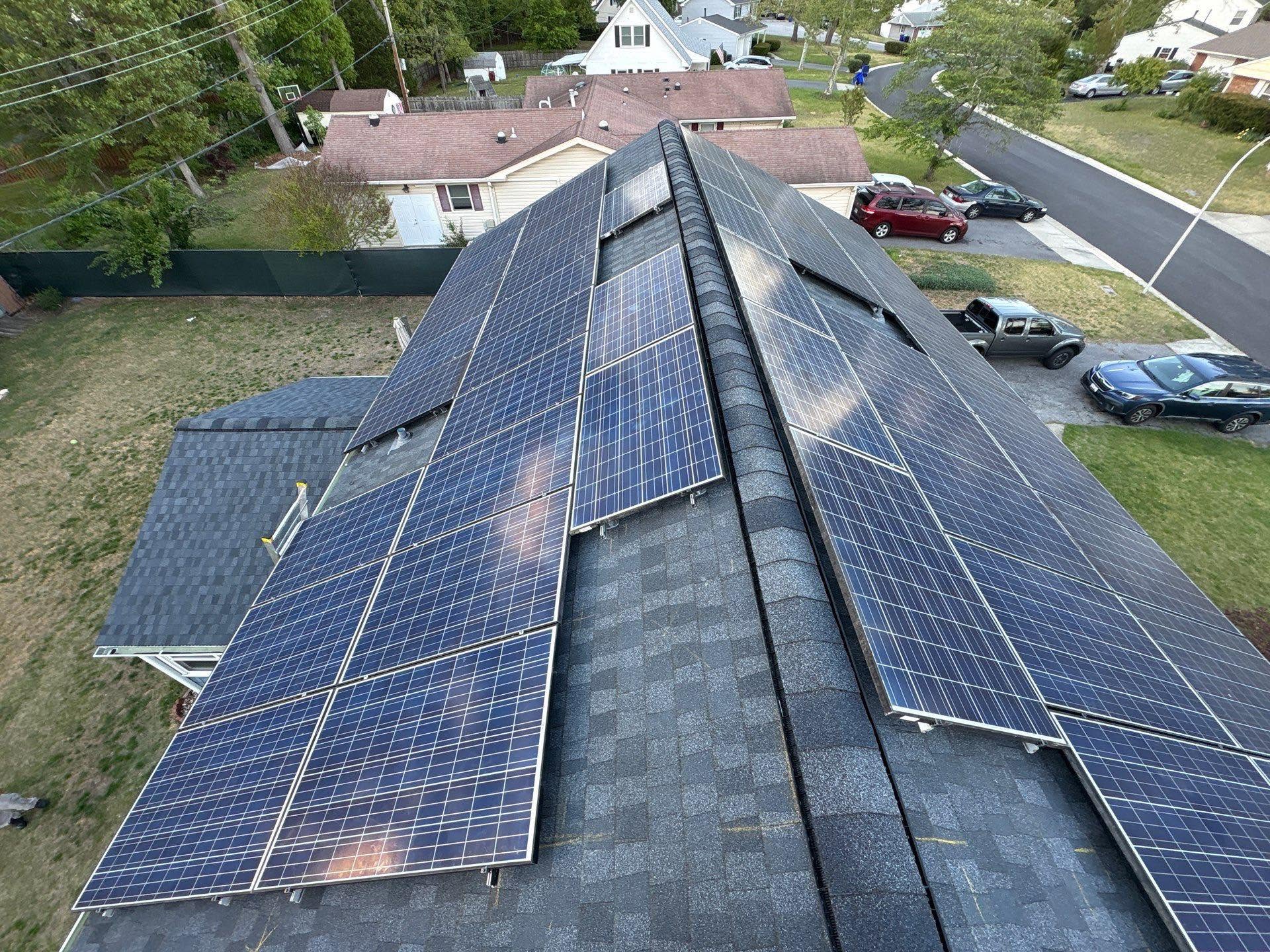 Crew installing a residential rooftop solar array
