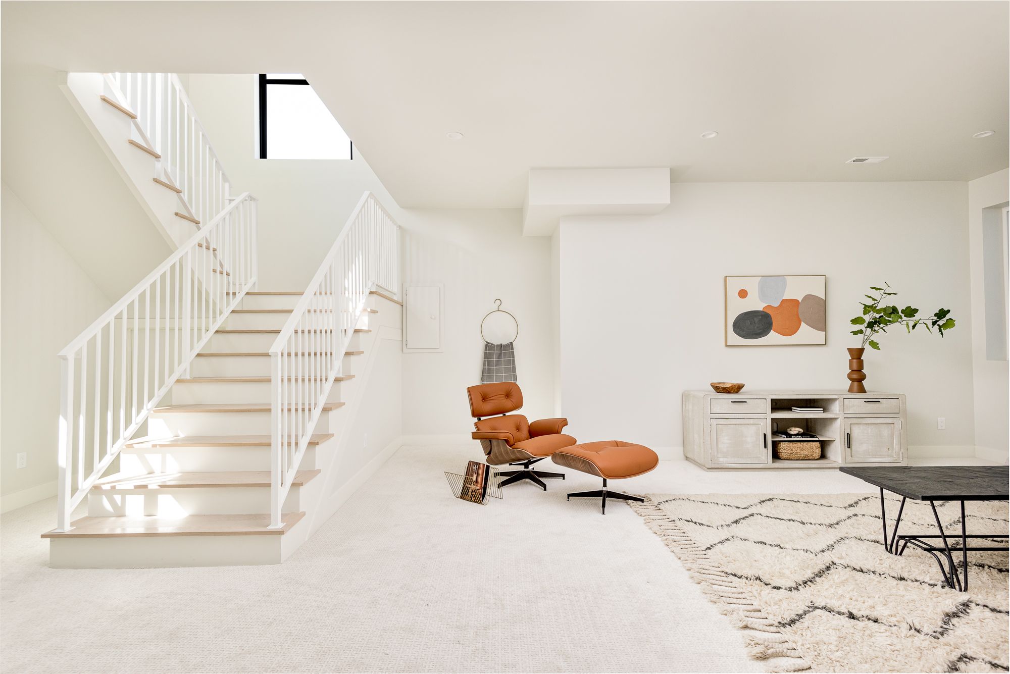 Lower-level family room looking toward the stair