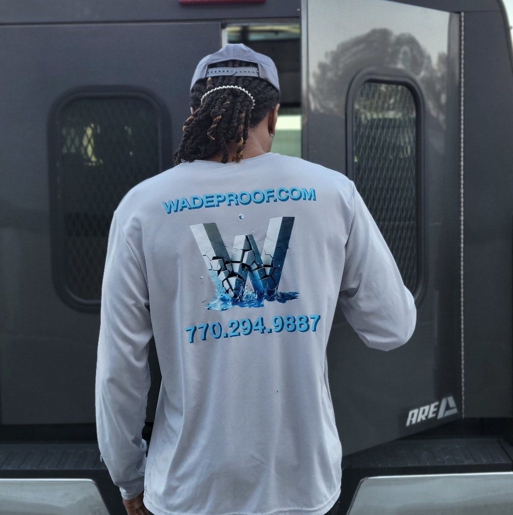 Wade Drainage crew member in branded shirt