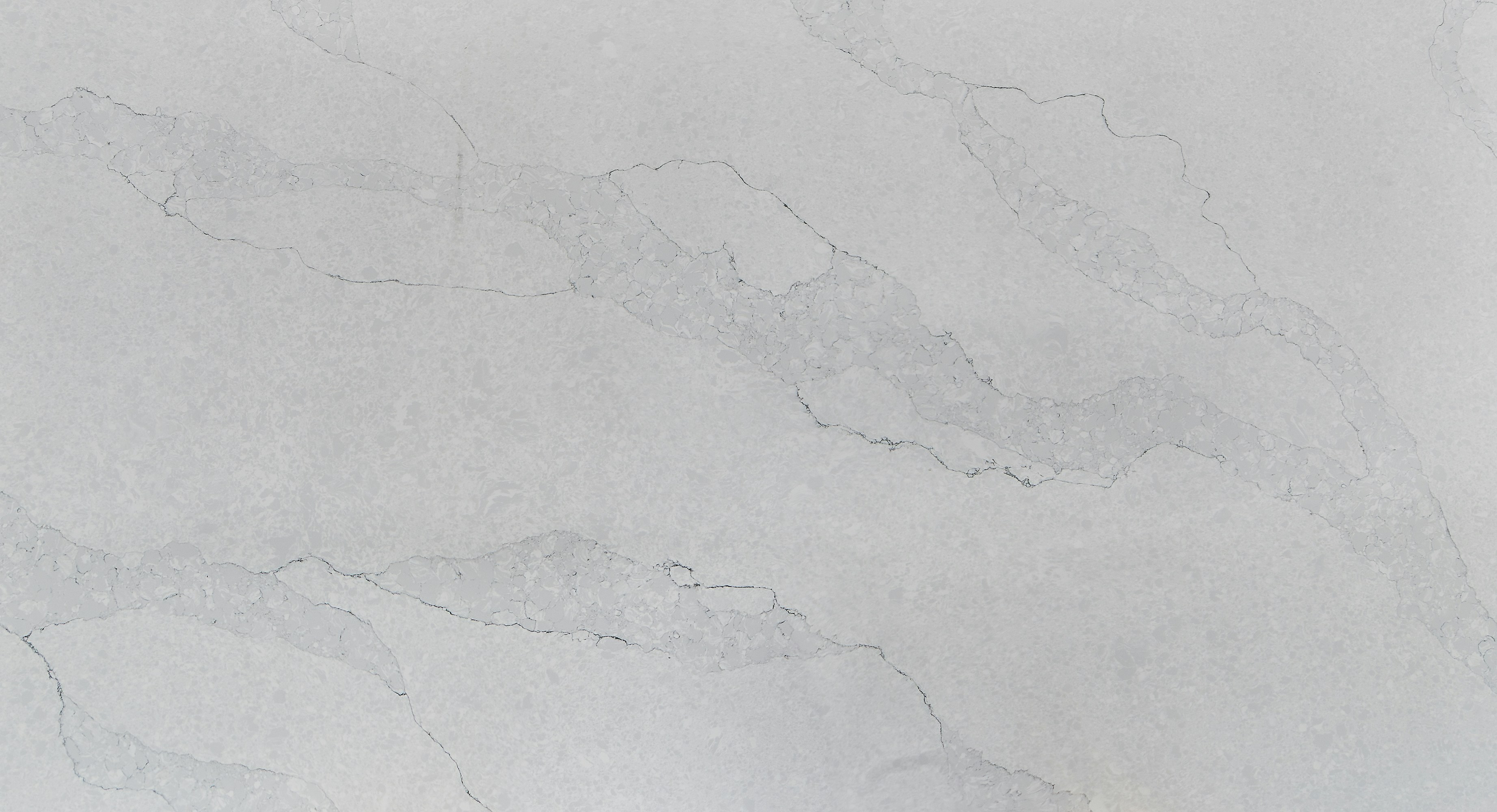 Single calacatta marble slab backsplash with no grout lines