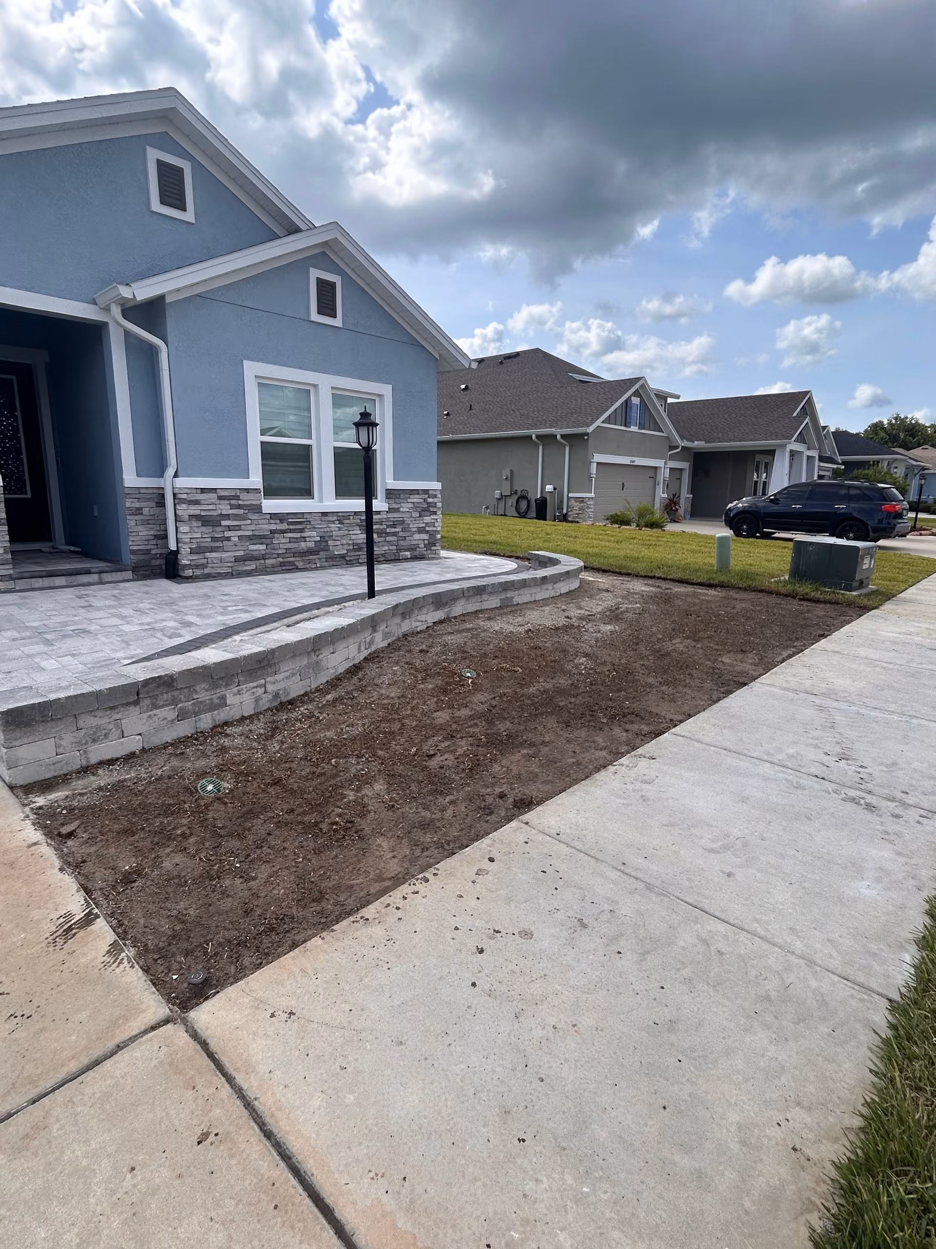 Drainage Correction and Bahia Sod Install Next to a New Paver Patio
