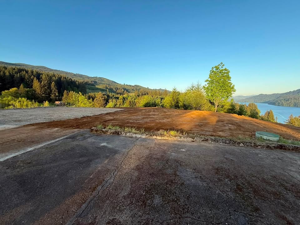 Cleared job site overlooking the river, ready to build