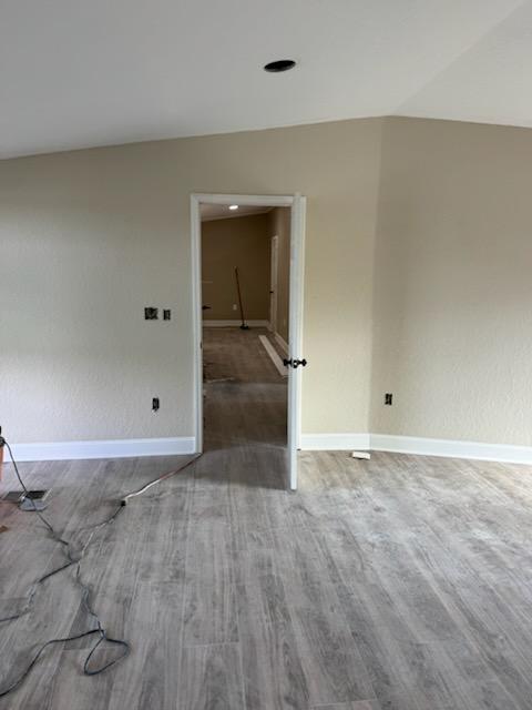 Grey wood-look plank flooring finished wall to wall through a mobile home doorway