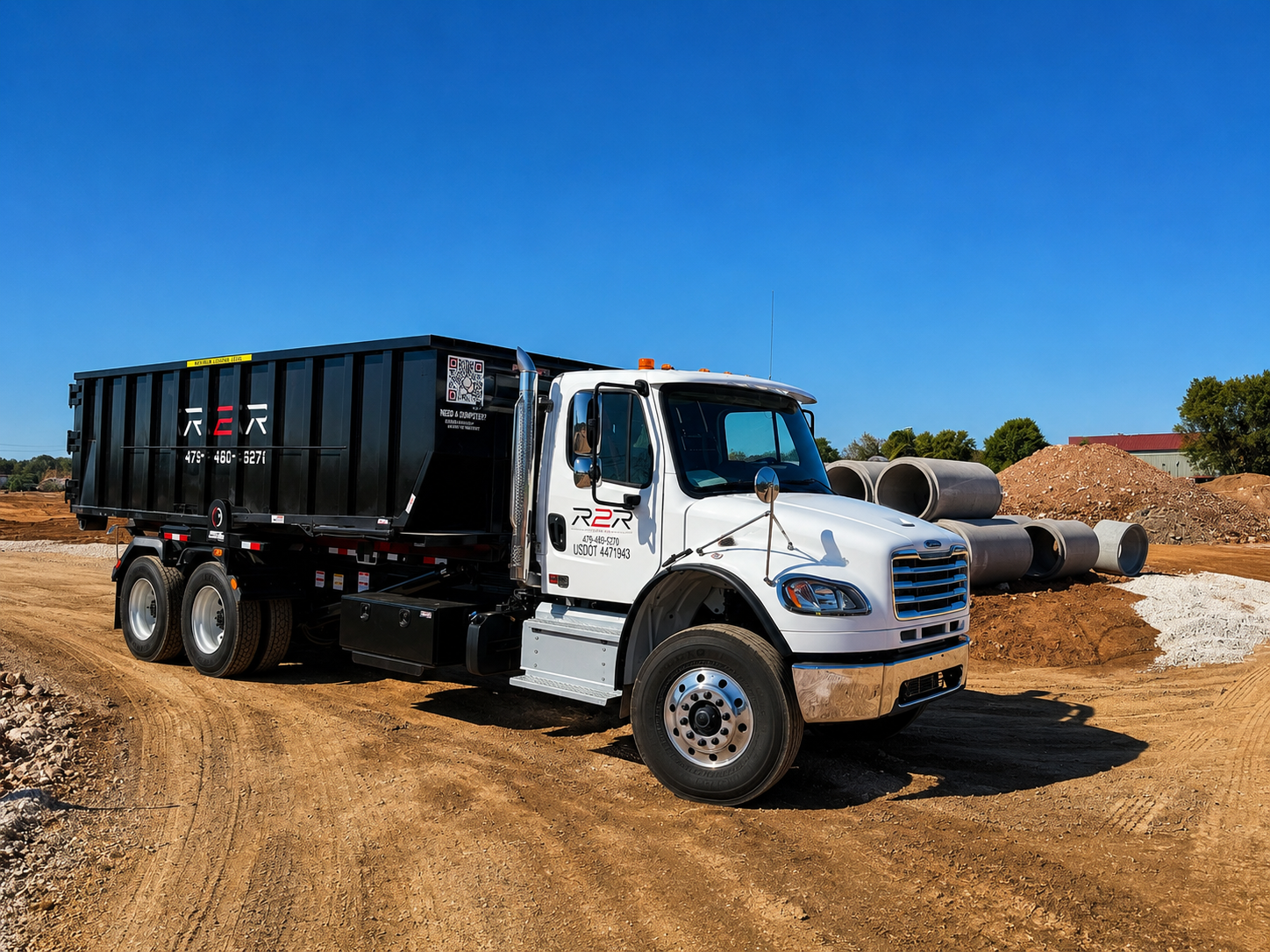 R2R roll-off dumpster on an active job site in Northwest Arkansas