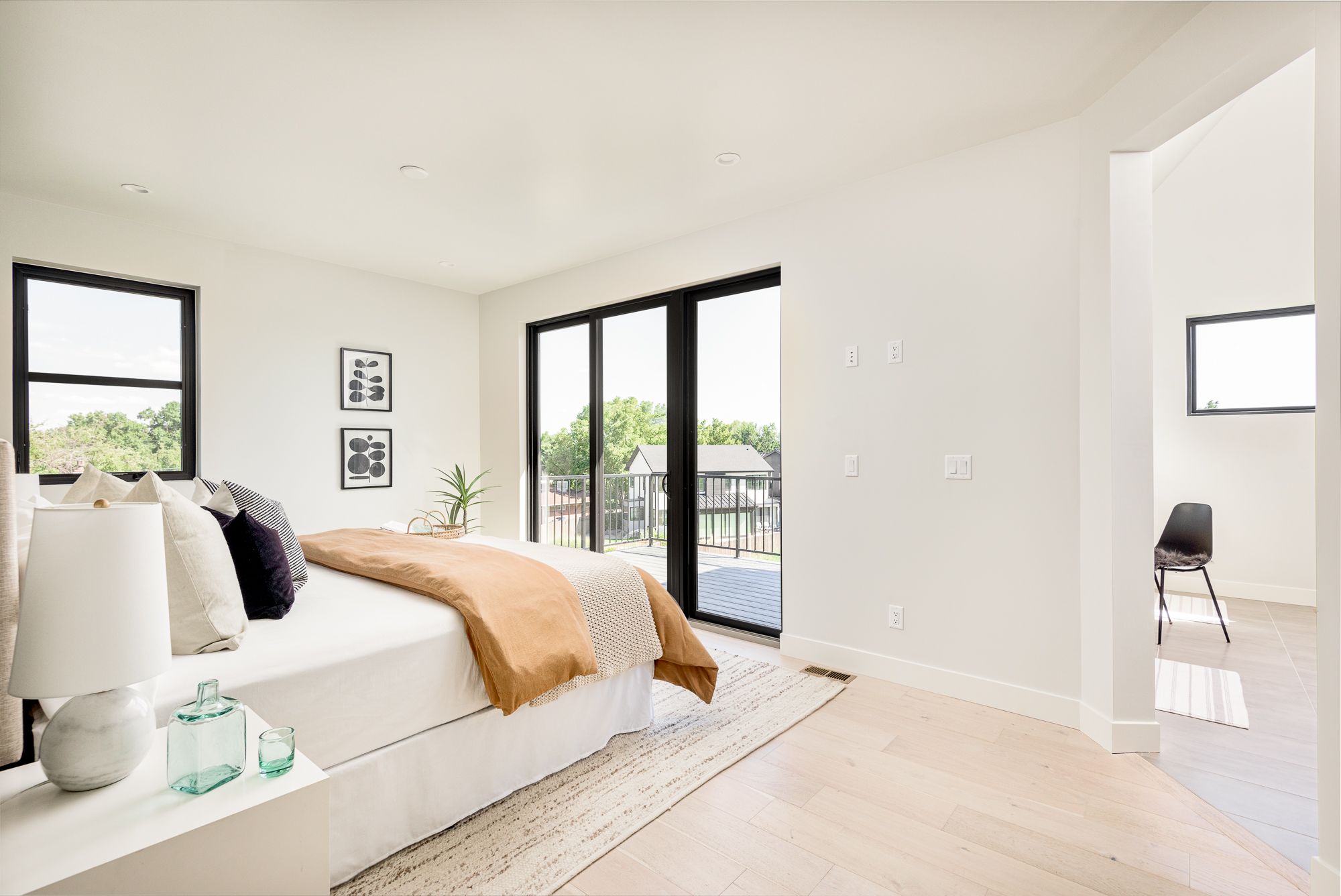 Primary bedroom with a slider to the upper balcony