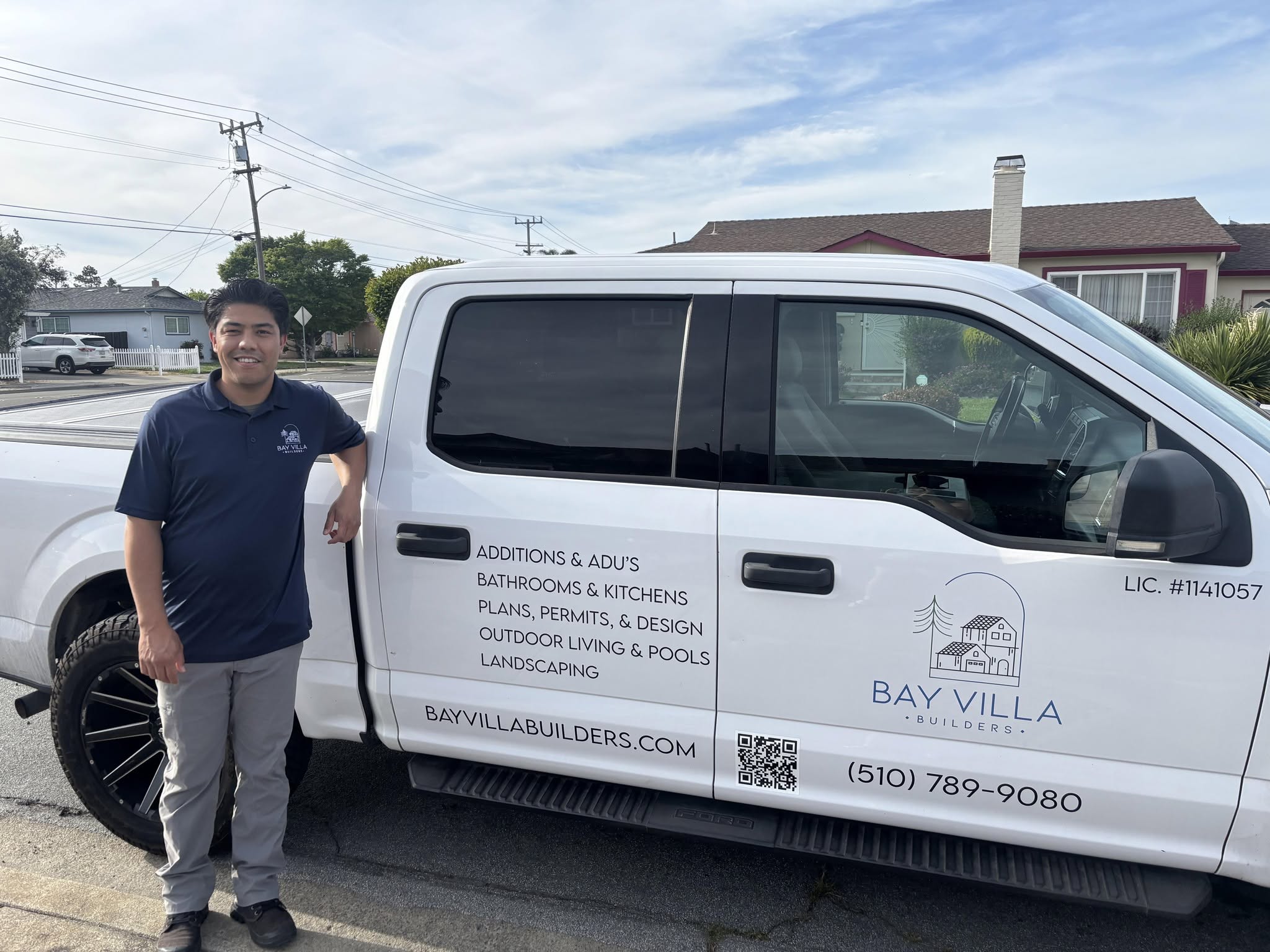 Bay Villa Builders team member beside a company truck in Newark, California