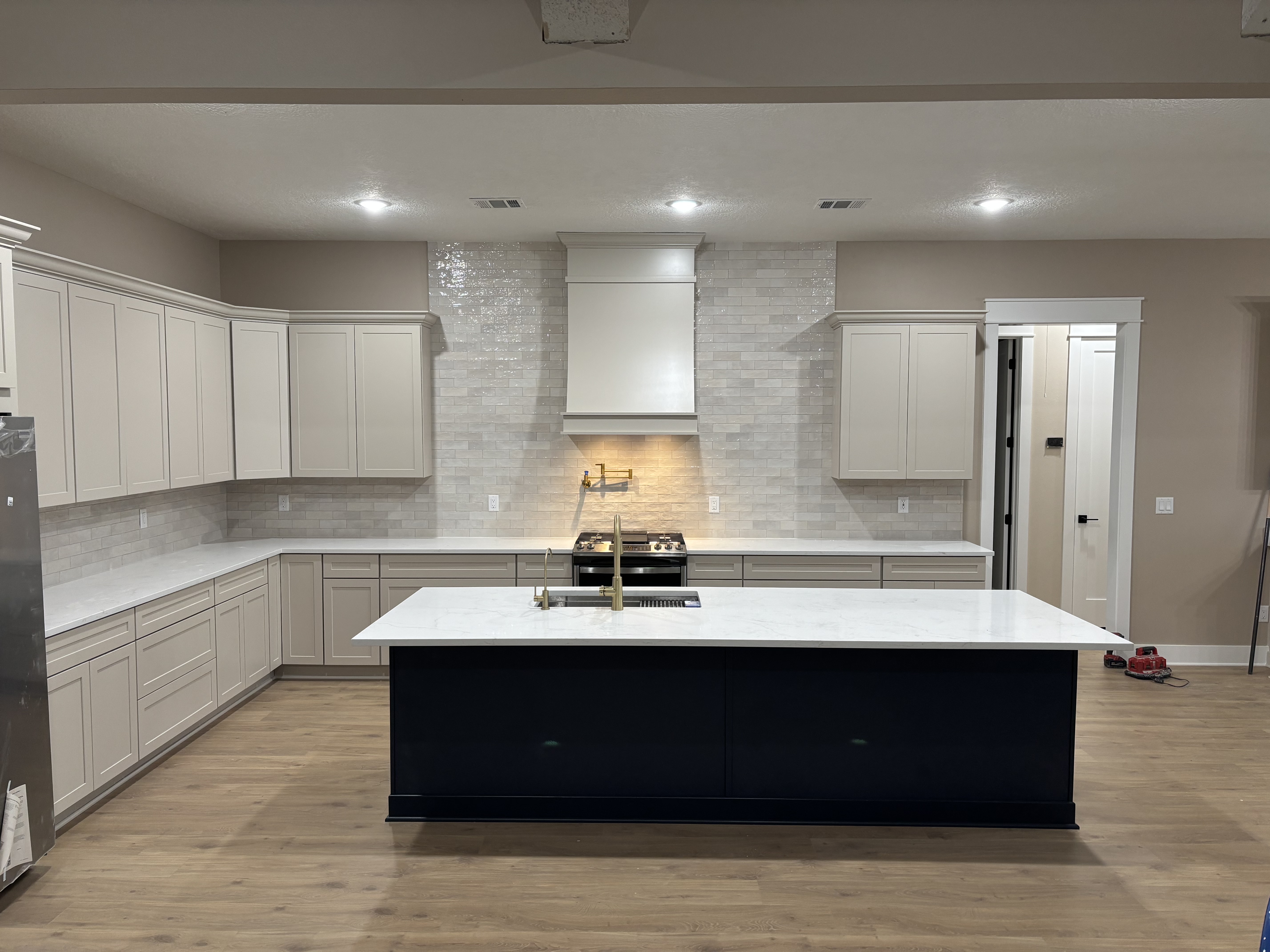 Renovated kitchen with navy island
