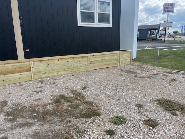Wood skirting panels on a manufactured home