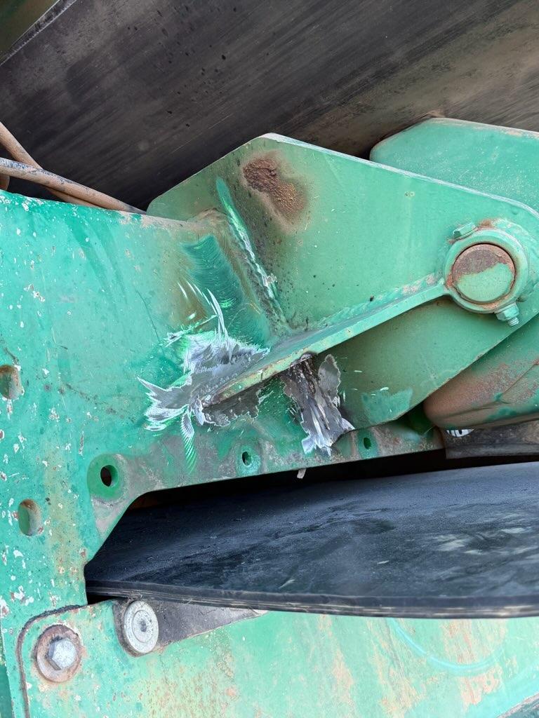 Close-up of the cracked weld on the main boom before repair