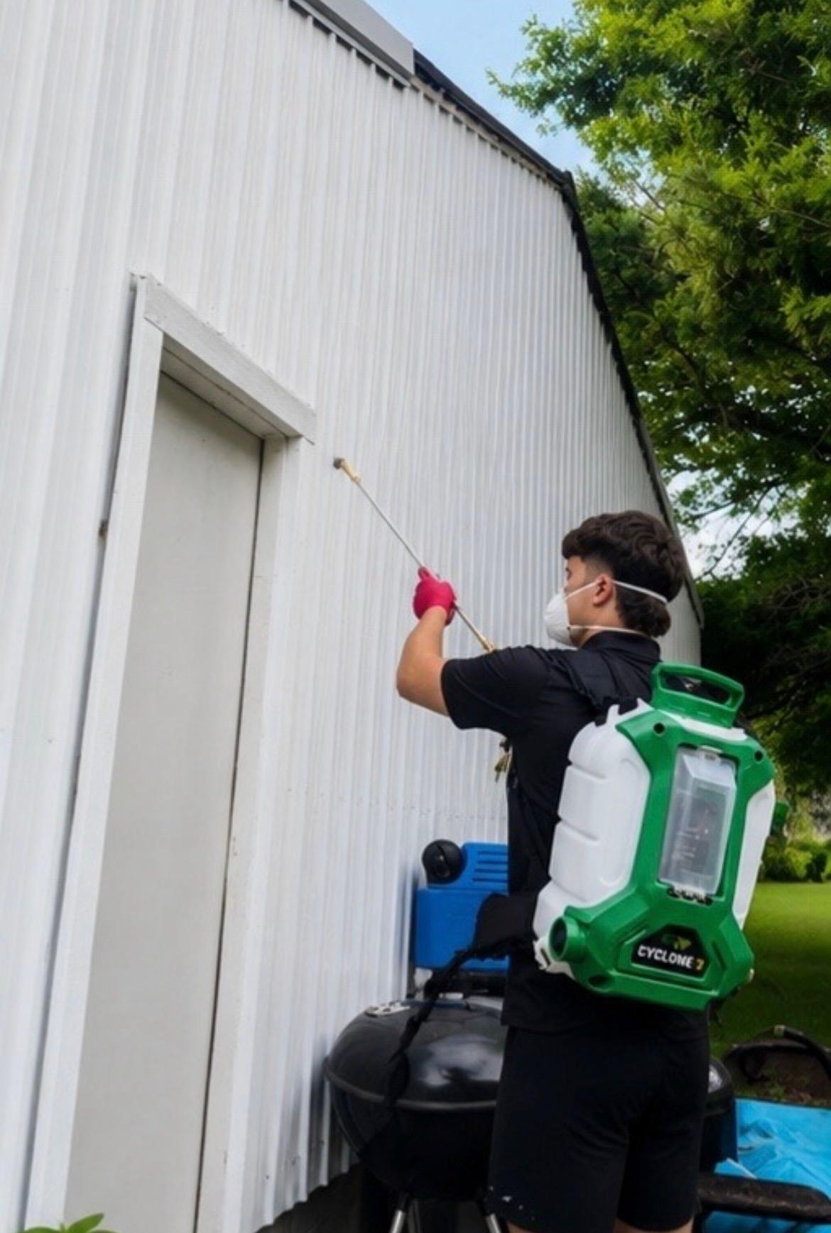 Kick-A-Pest technician performing pest treatment