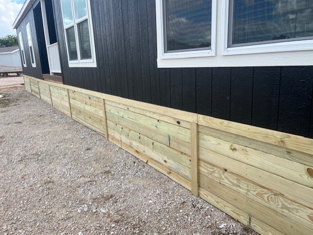 Wood mobile home skirting project by Bakers Carpentry in Joshua, TX
