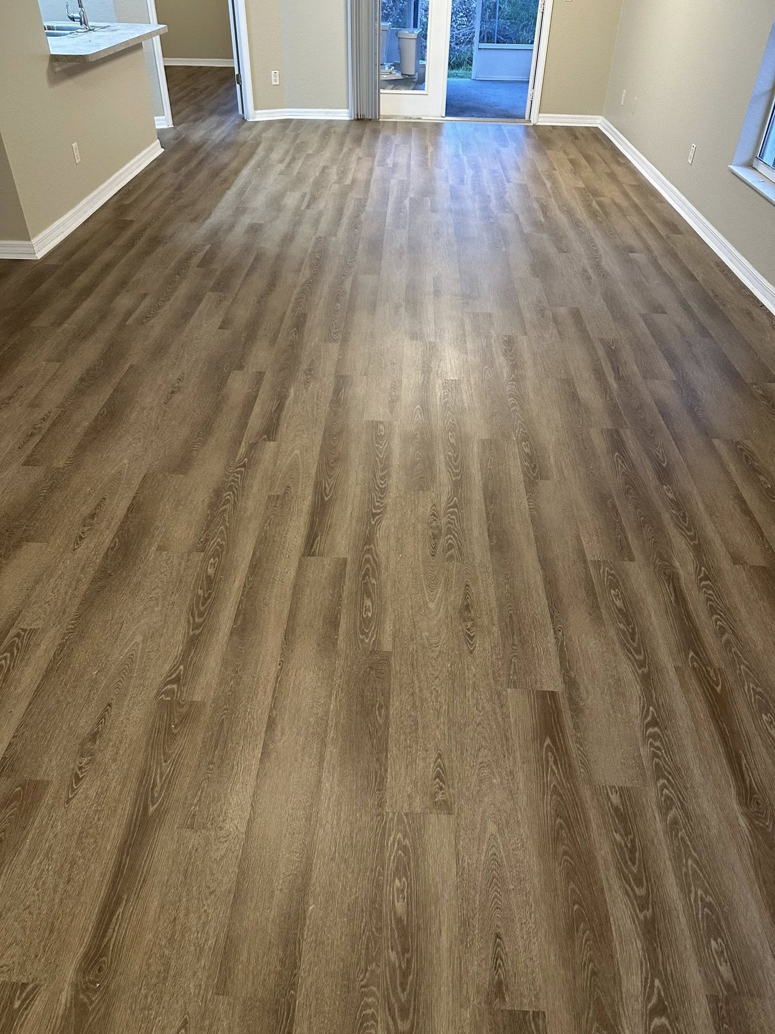 Open plan Tampa, FL home with new warm oak plank flooring