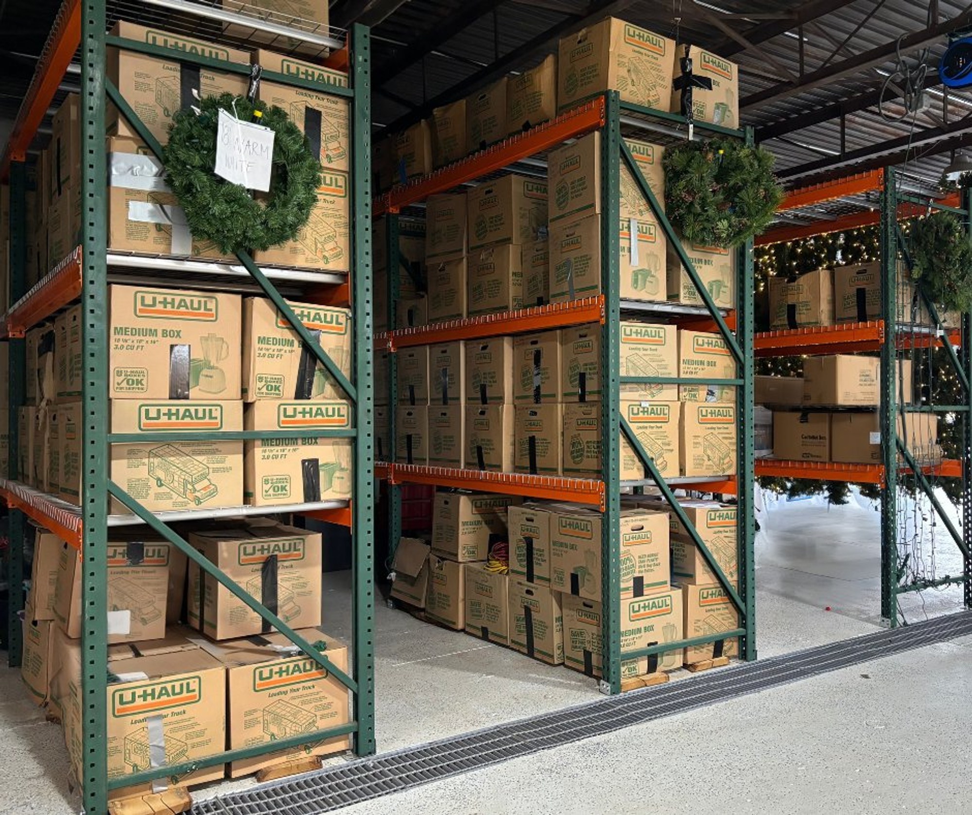 Labeled bins of Christmas lights in storage