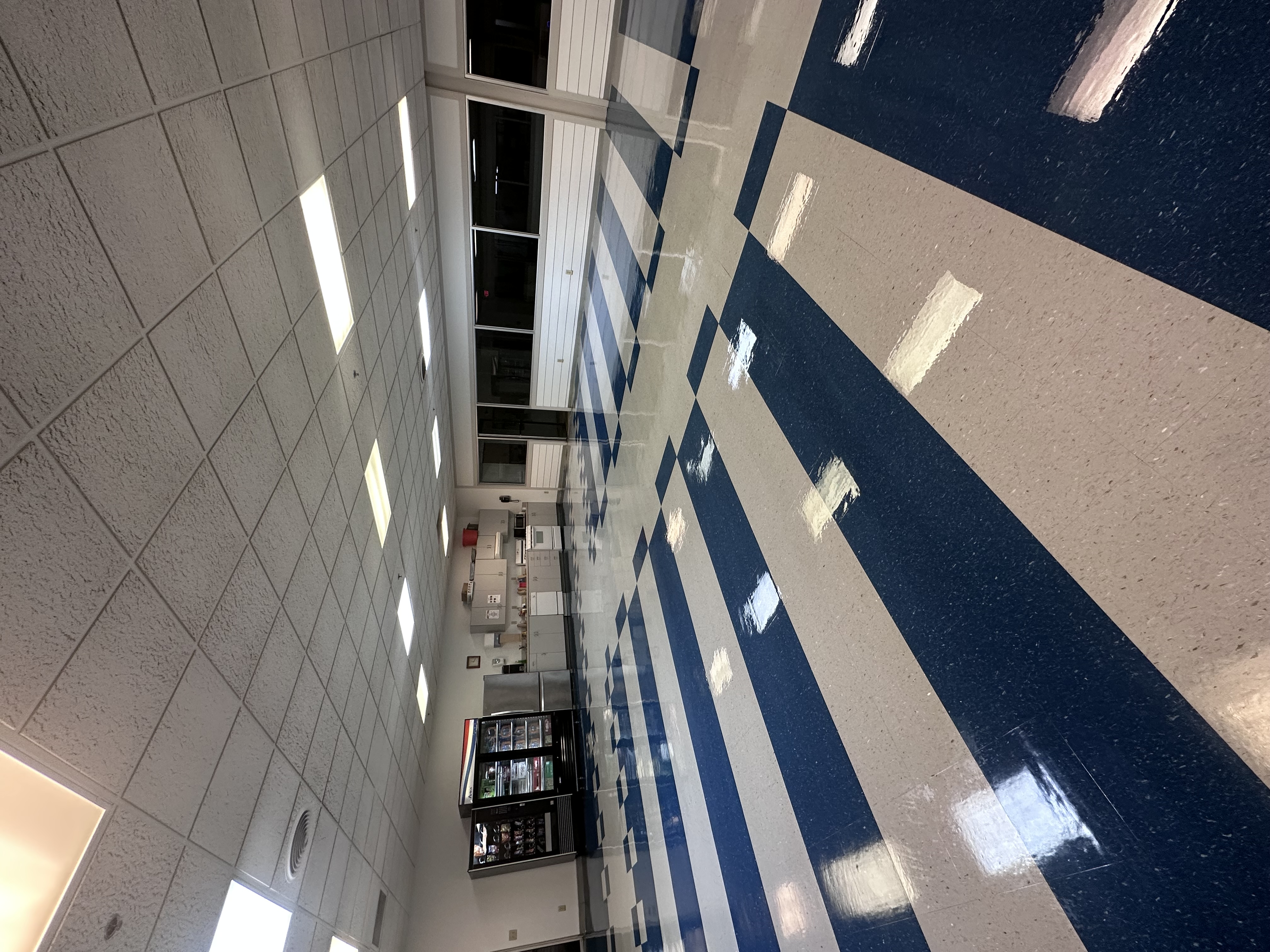 Large break room with high-gloss stripped and refinished vinyl tile flooring