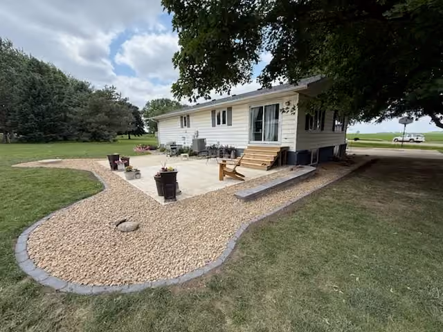 Revitalized Outdoor Space in Sioux Center with Elegant Rock Edging