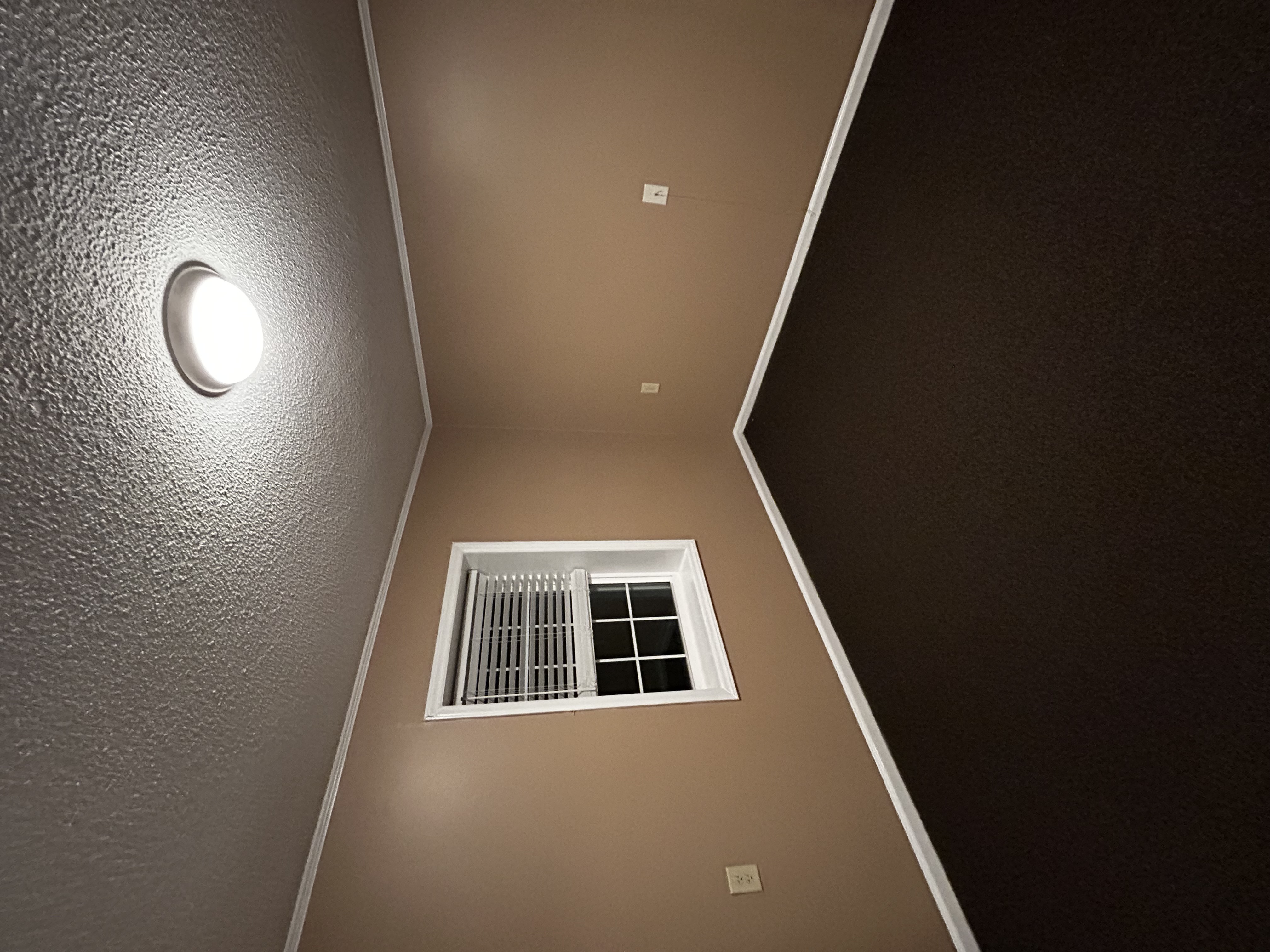 Interior stairwell repainted in warm tones