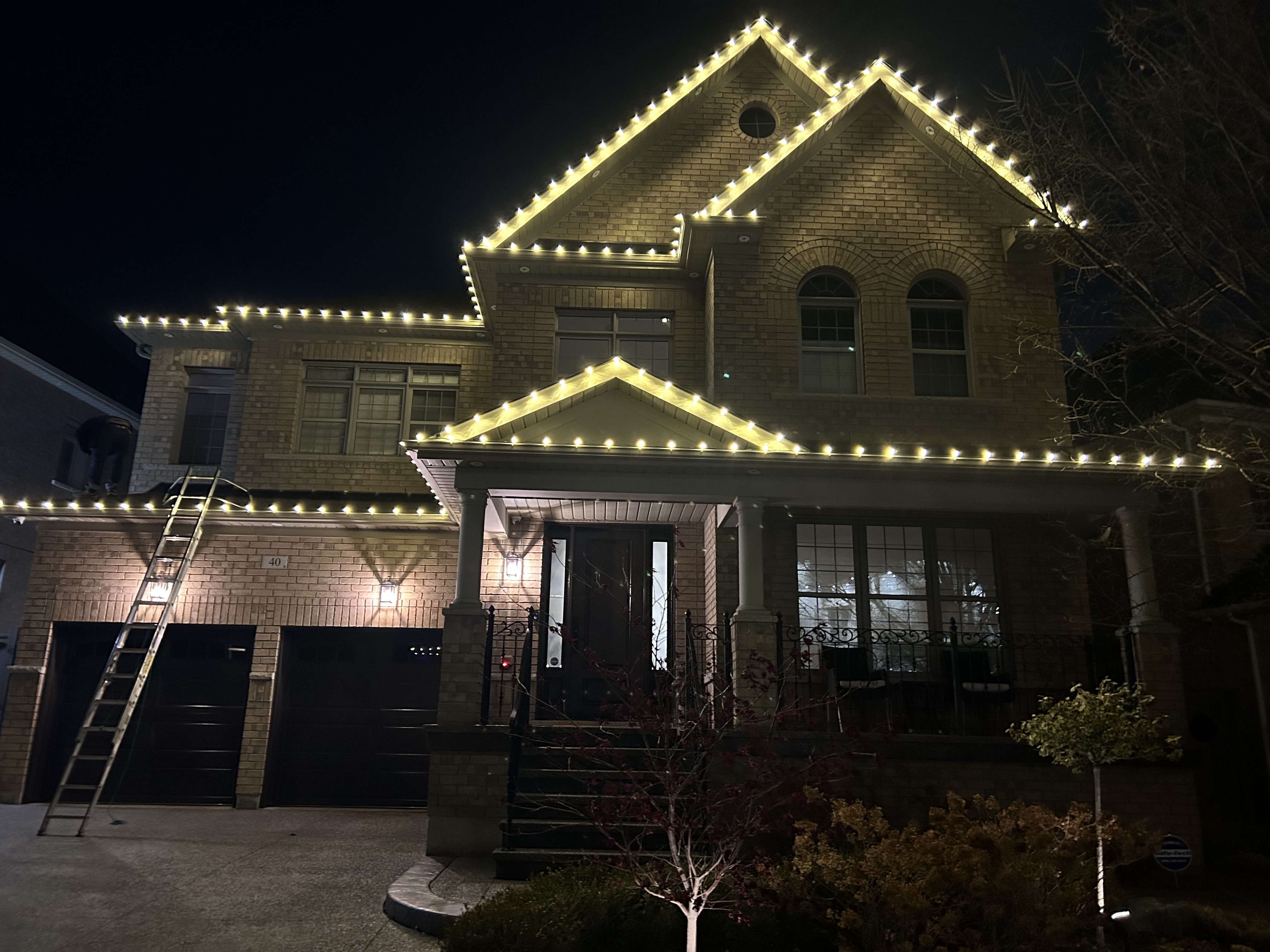 House with lights in snow