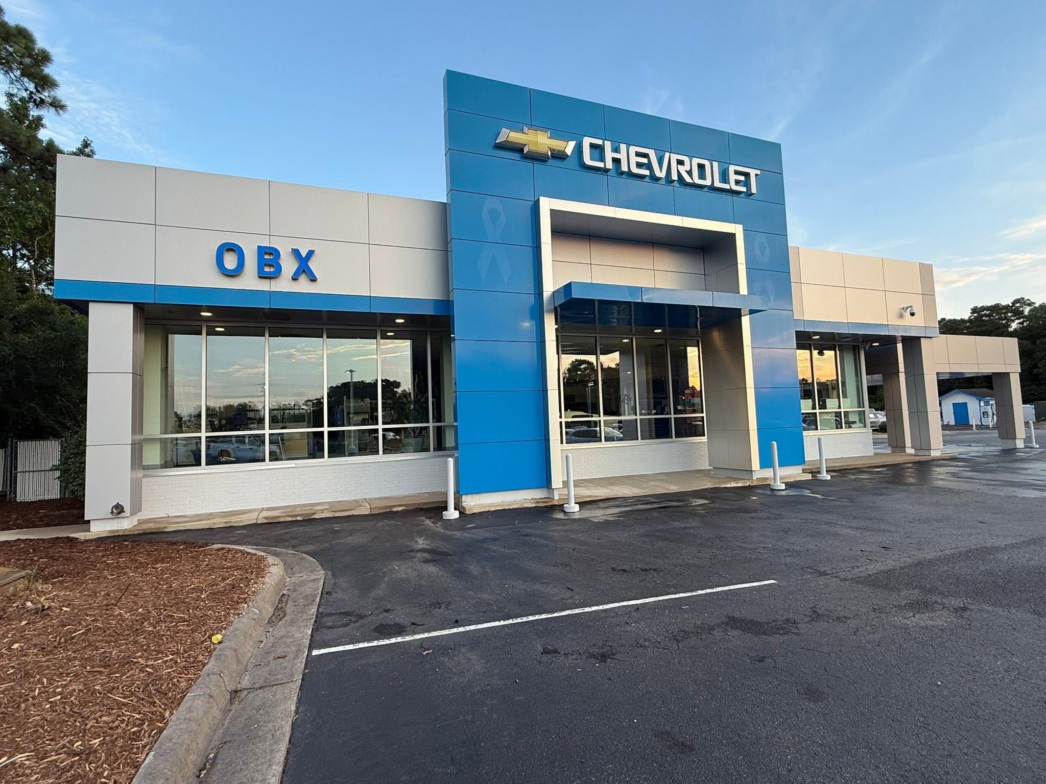 Commercial pressure washing at an Outer Banks car dealership